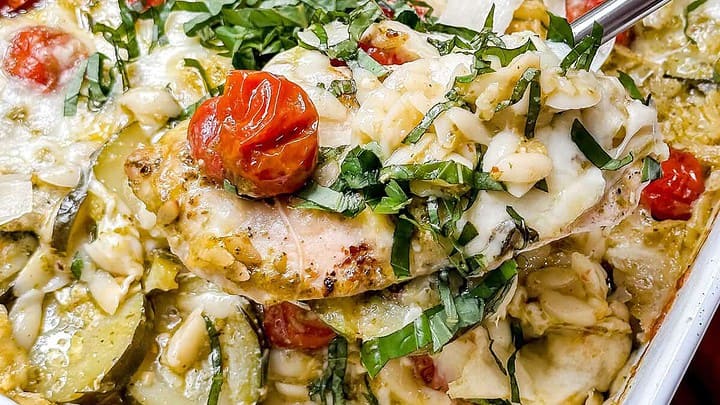 Closeup view of pesto chicken on a spoon for serving.