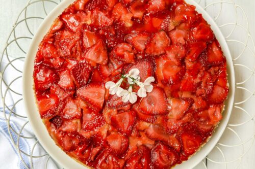 Top view of Strawberry Upside Down Cake in a white wire serving platter.