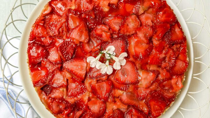 Top view of Strawberry Upside Down Cake in a white wire serving platter.