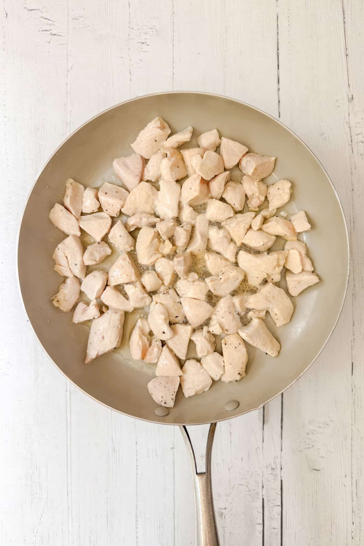 A pan of chicken and broccoli, perfectly cooked for a delicious and wholesome meal.