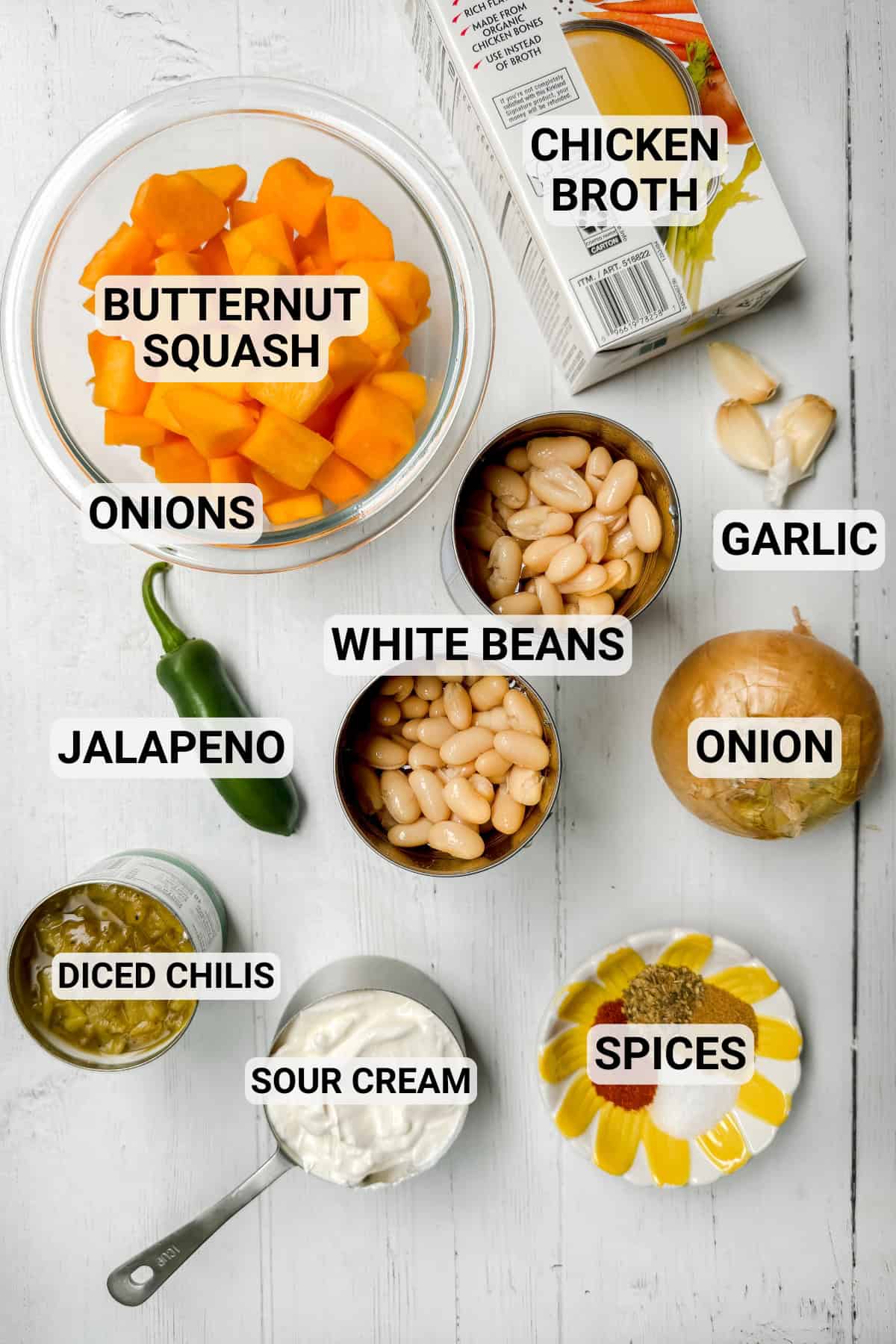 Butternut white chicken chili ingredients with labels like beans, squash, garlic, chilies, and spices.