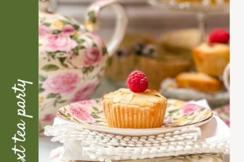 A Mini Bakewell Tart topped with a raspberry sits on a floral plate, with a vintage teapot and more mini Bakewell tarts in the background. Text reads: "Bakewell Tarts—Easy Teatime Treat! For your next tea party. 31.
