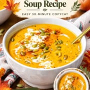 Pinterest pin for Panera Autumn Squash Soup featuring a creamy squash soup bowl topped with pepitas and cream.