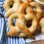 Soft homemade pretzels with mustard sauce for a German treat.
