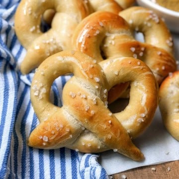 Soft homemade pretzels with mustard sauce for a German treat.