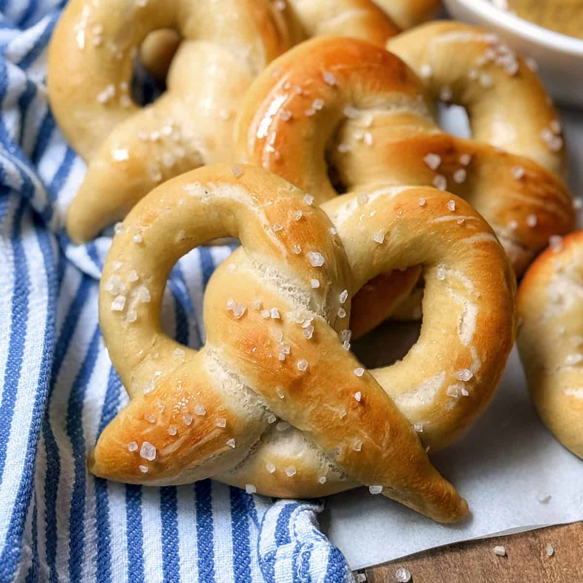 Soft homemade pretzels with mustard sauce for a German treat.