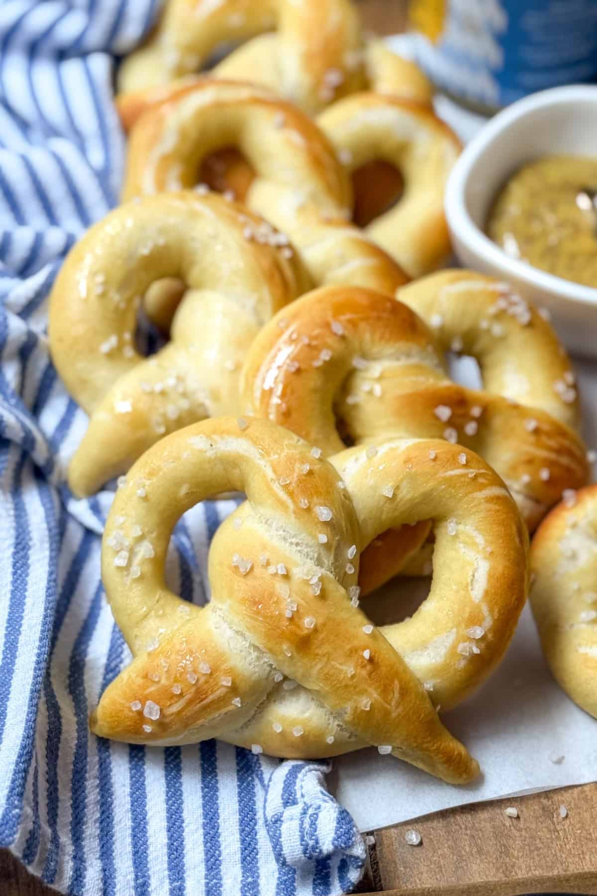 Close-up freshly baked soft pretzels on a cloth linen.