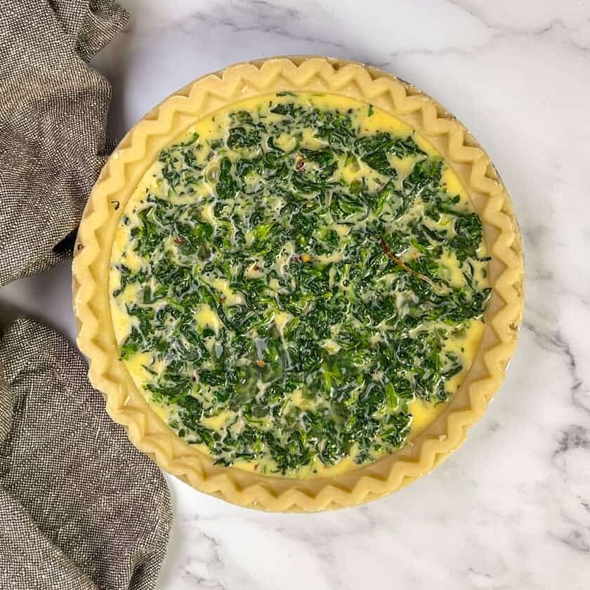 Unbaked Spinach Quiche in Pastry Shell