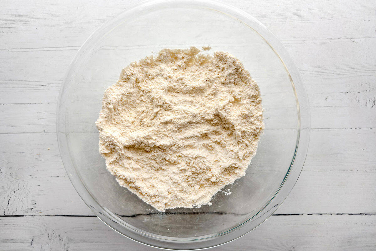 Flour mixture in a glass bowl for afternoon tea scones.