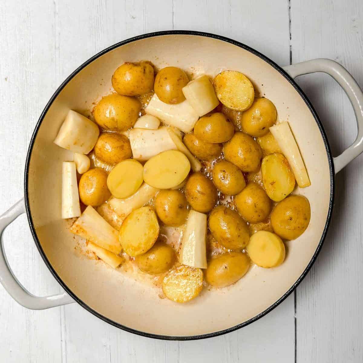Root vegetables added to the same braising pot and sauteing.
