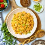 Square overhead photo of Buffalo Chicken Mac and Cheese with salad and garnishes.