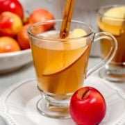 Pinterest Pin with glass mug of crockpot apple cider with the words "Crockpot Apple Cider" and "31Daily.com."