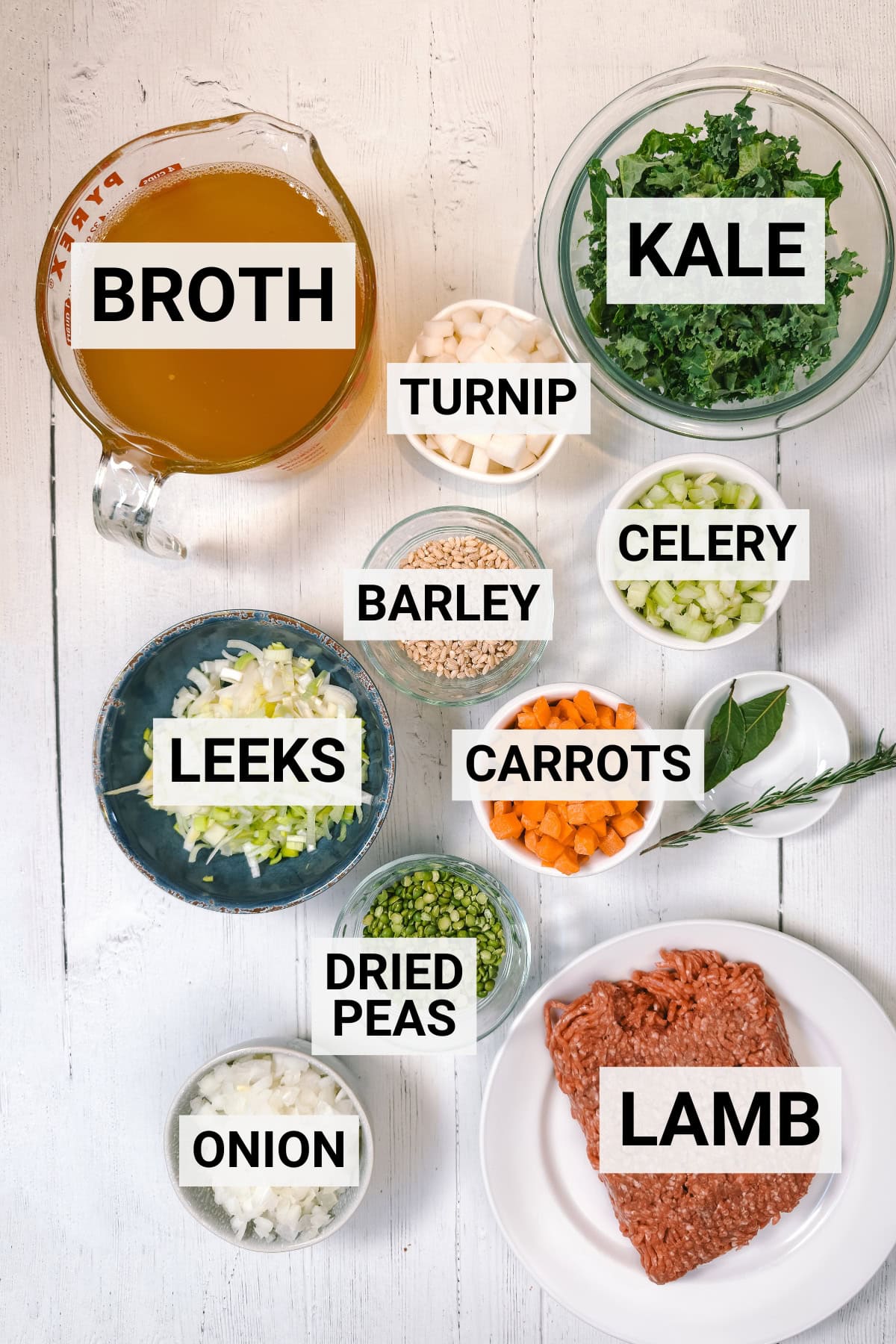 Scotch Broth ingredients including root vegetables, ground lamb, kale, barley, dried peas, and seasoning.
