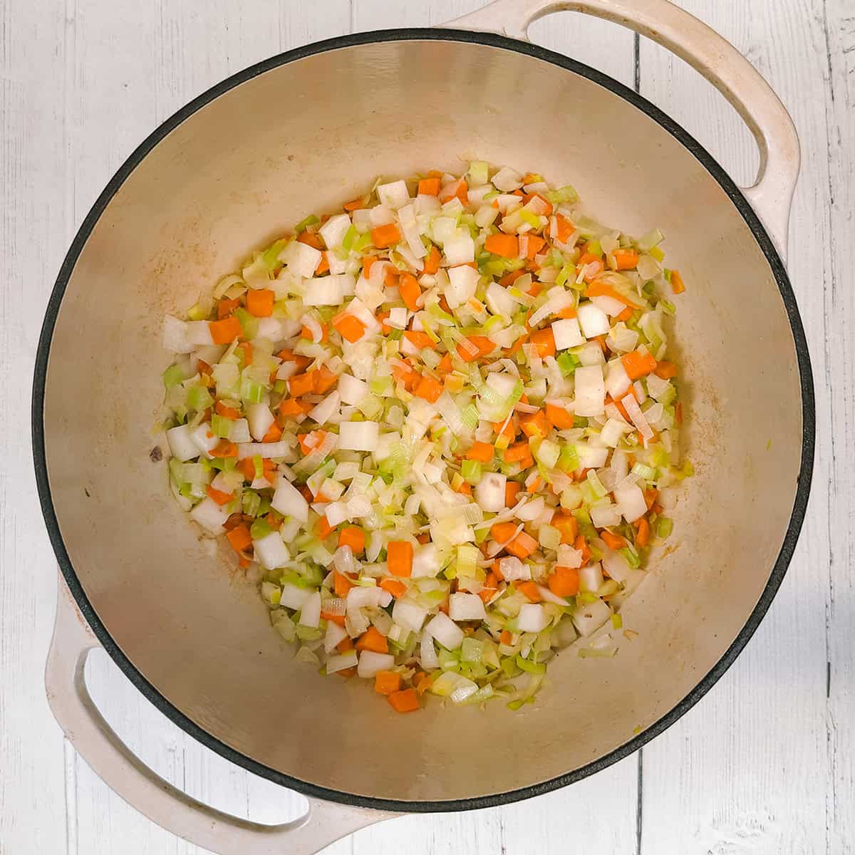 Saut&eacute;ing vegetables in a large soup pot for Scotch Broth.