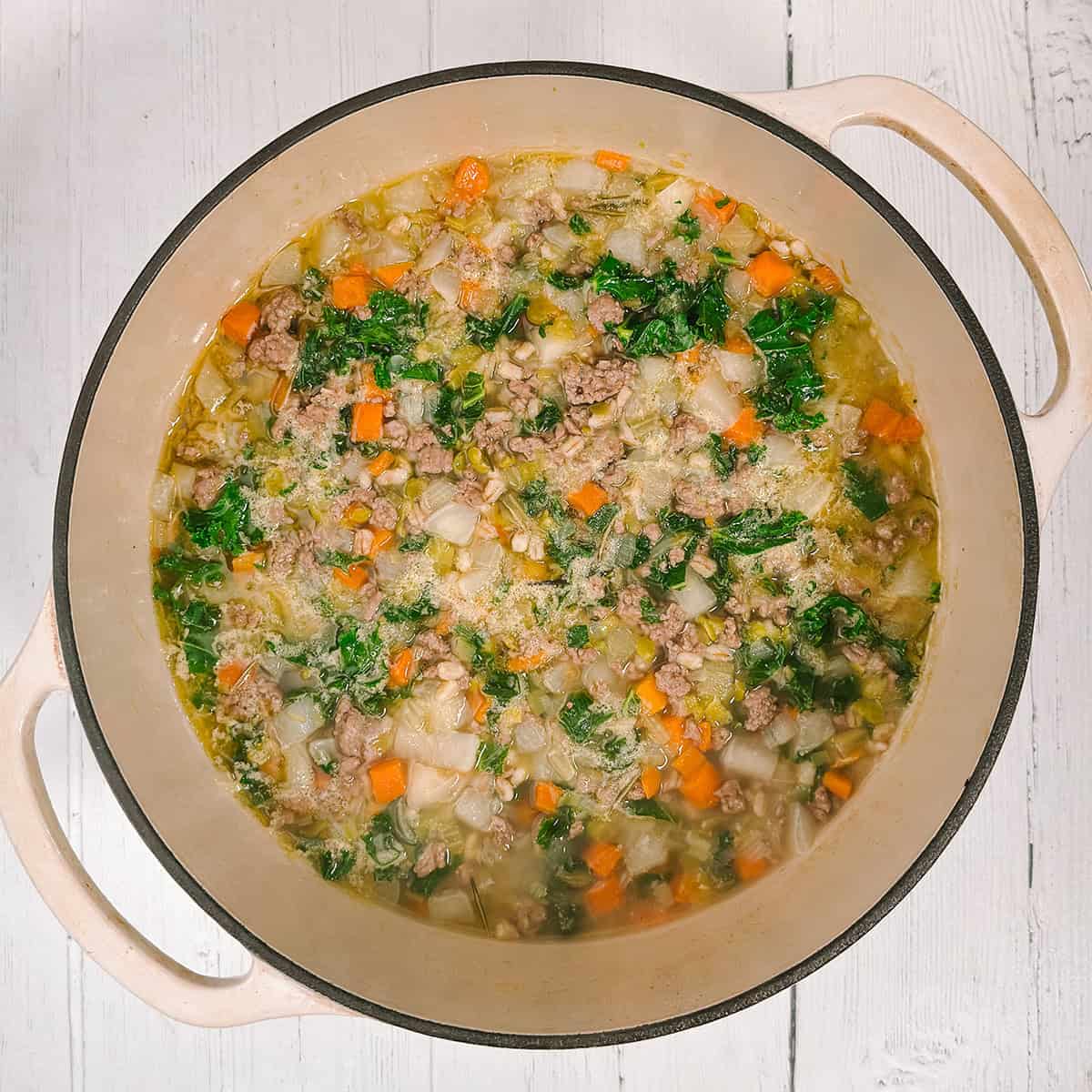 Cooking Scotch Broth soup in a large pot.