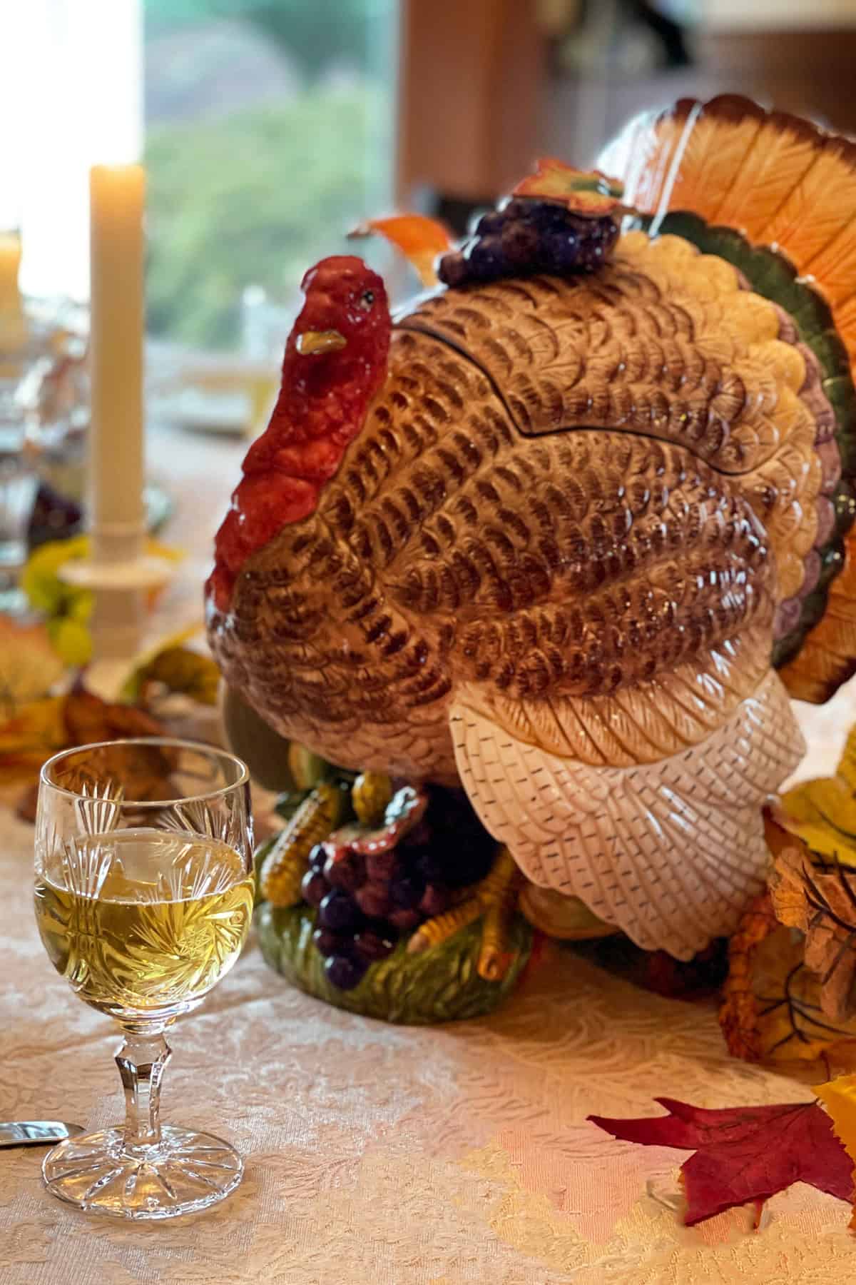 Thanksgiving Table with a ceramic turkey centerpiece.