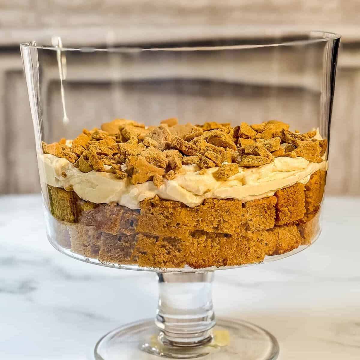 Second layer of pumpkin trifle consists of pumpkin Chantilly cream and crumbled cookies.