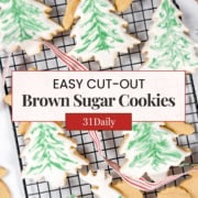 Pinterest image featuring an overhead view of decorated Christmas tree cookies on a metal rack.