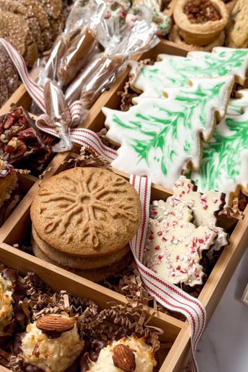 Square closeup view of Woodland Christmas Cookie Box featuring international cookies with warm flavors, Southern classics, and nostalgic treats like sugar cookie cutouts.