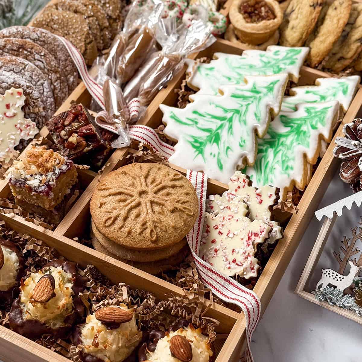 Square closeup view of Woodland Christmas Cookie Box featuring international cookies with warm flavors, Southern classics, and nostalgic treats like sugar cookie cutouts.