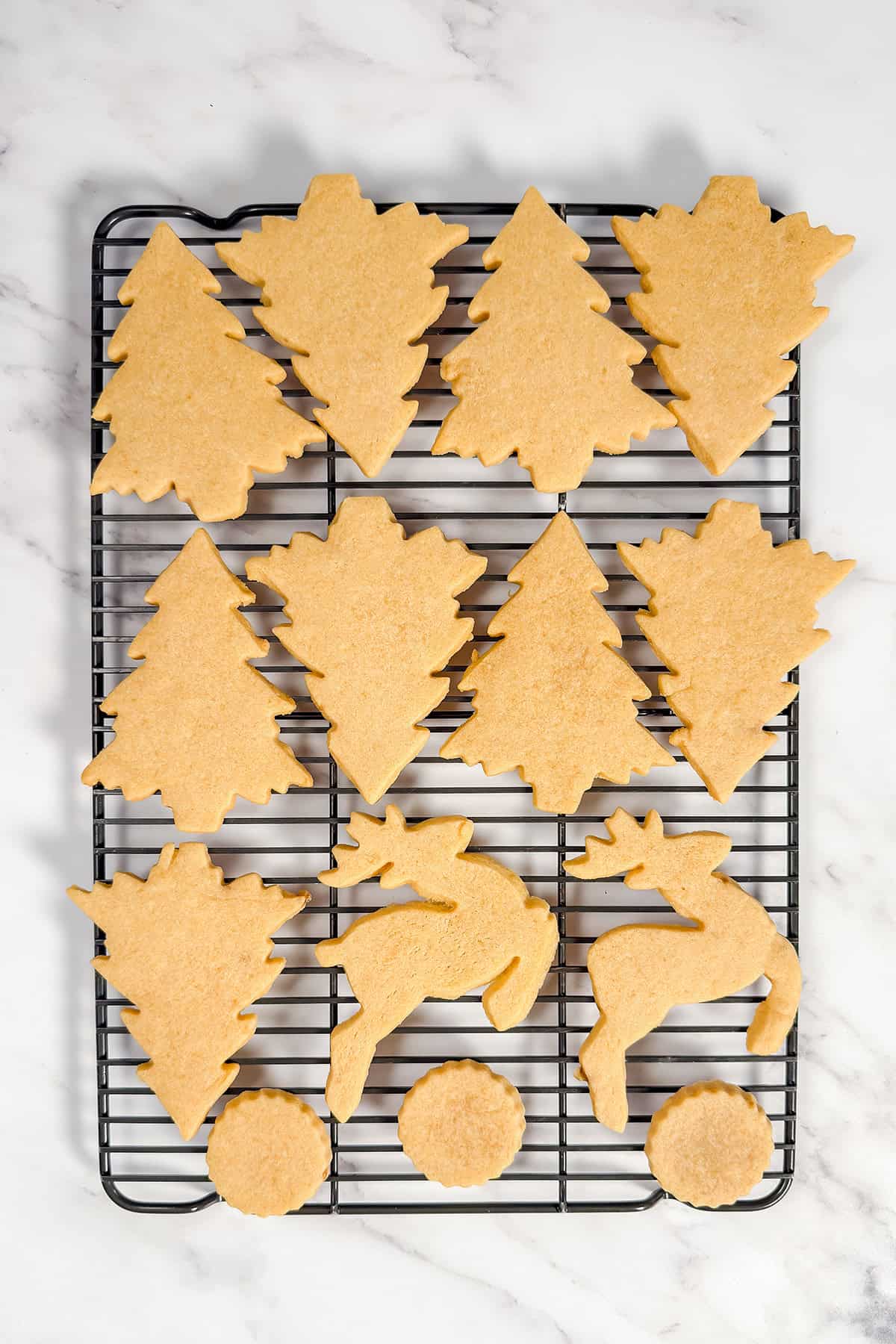 Baked brown sugar cookies on a wire rack for cooling.