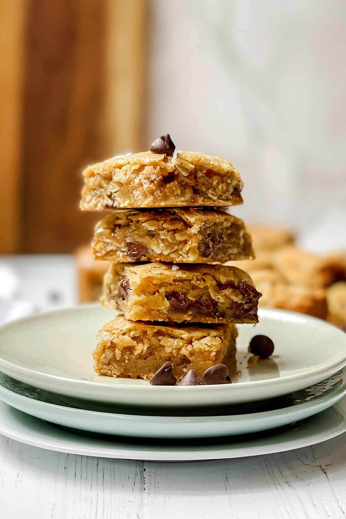 Stacked oatmeal chocolate chip cookie bars showing soft, chewy centers.
