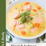 A bowl of Finnish Salmon Soup with tender salmon chunks, potatoes, carrots, and dill garnish, served with bread on the side. Text reads: "Finnish Salmon Soup – Ready in 30 Minutes.