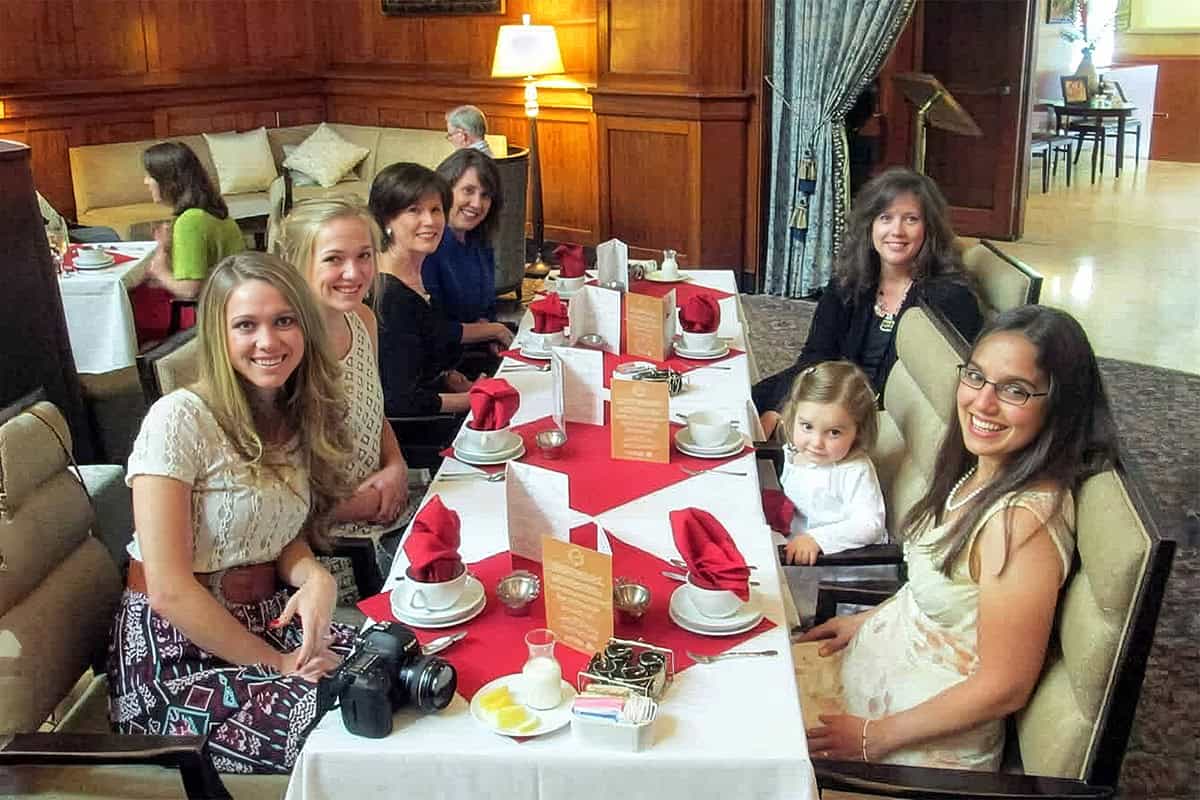Stephanie Wilson, founder of 31Daily, and her family sit around an afternoon tea table at Portland's Heathman Hotel.