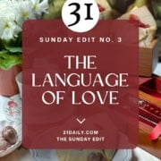 A table setting with cake, flowers, and a plate reading "Love," overlaid with text: "Sunday Edit No. 3 - The Language of Love - 31daily.com The Sunday Edit," perfect for a cozy game day gathering.