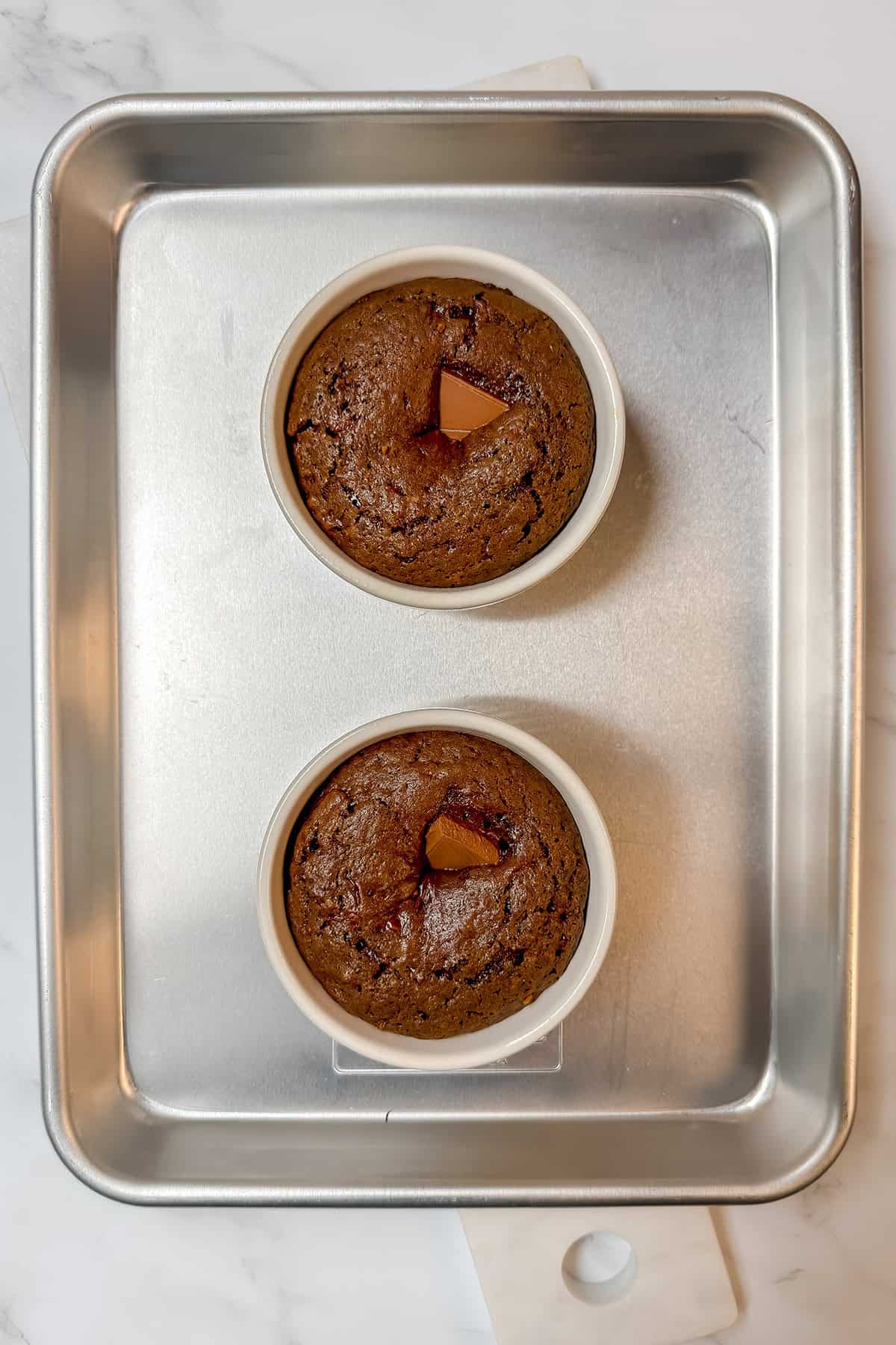 Mini chocolate cakes baked in ramekins with a lava-style chocolate center.