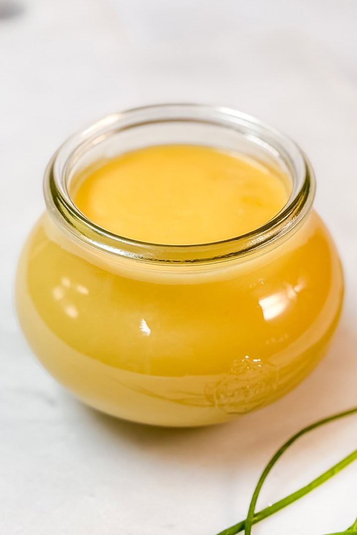 Homemade hollandaise sauce in a jar ready to serve.