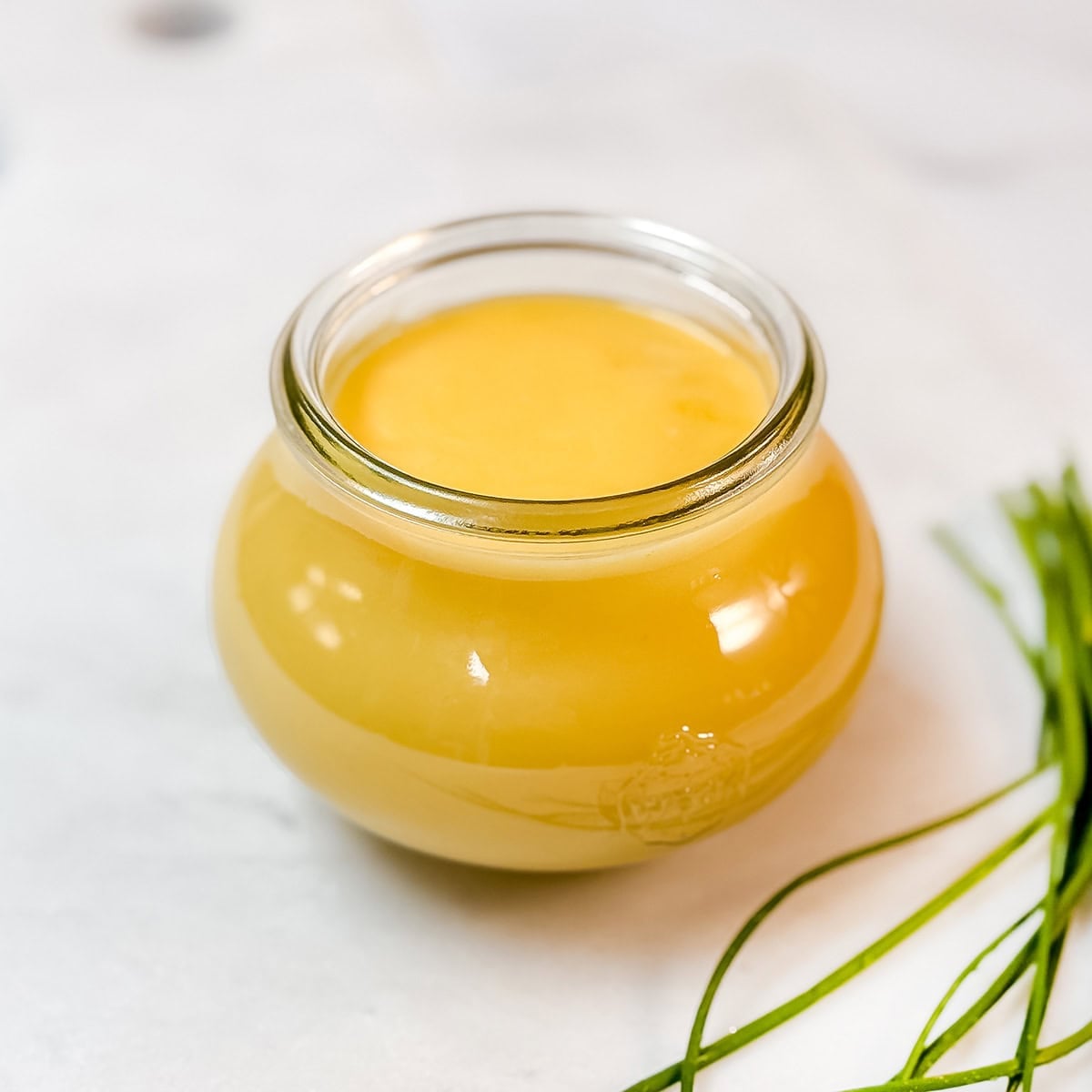 Homemade hollandaise sauce in a jar ready to serve.