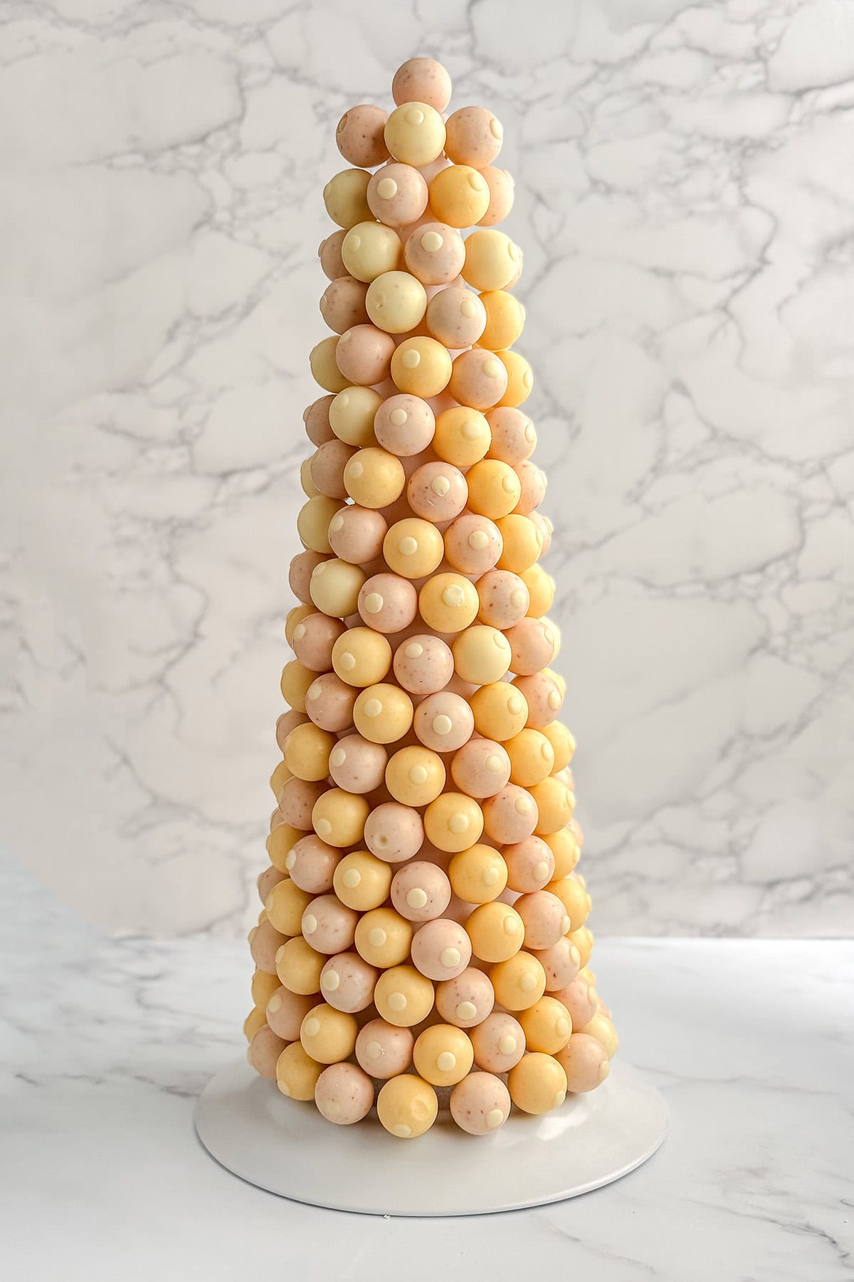 Bonbon tree nearly filled with pastel wrapped chocolate truffles.