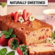 A loaf of strawberry honey yogurt bread, garnished with fresh strawberries and mint, is sliced on a marble board. Text reads “Healthy Strawberry Honey Yogurt Bread, Naturally Sweetened.”.
