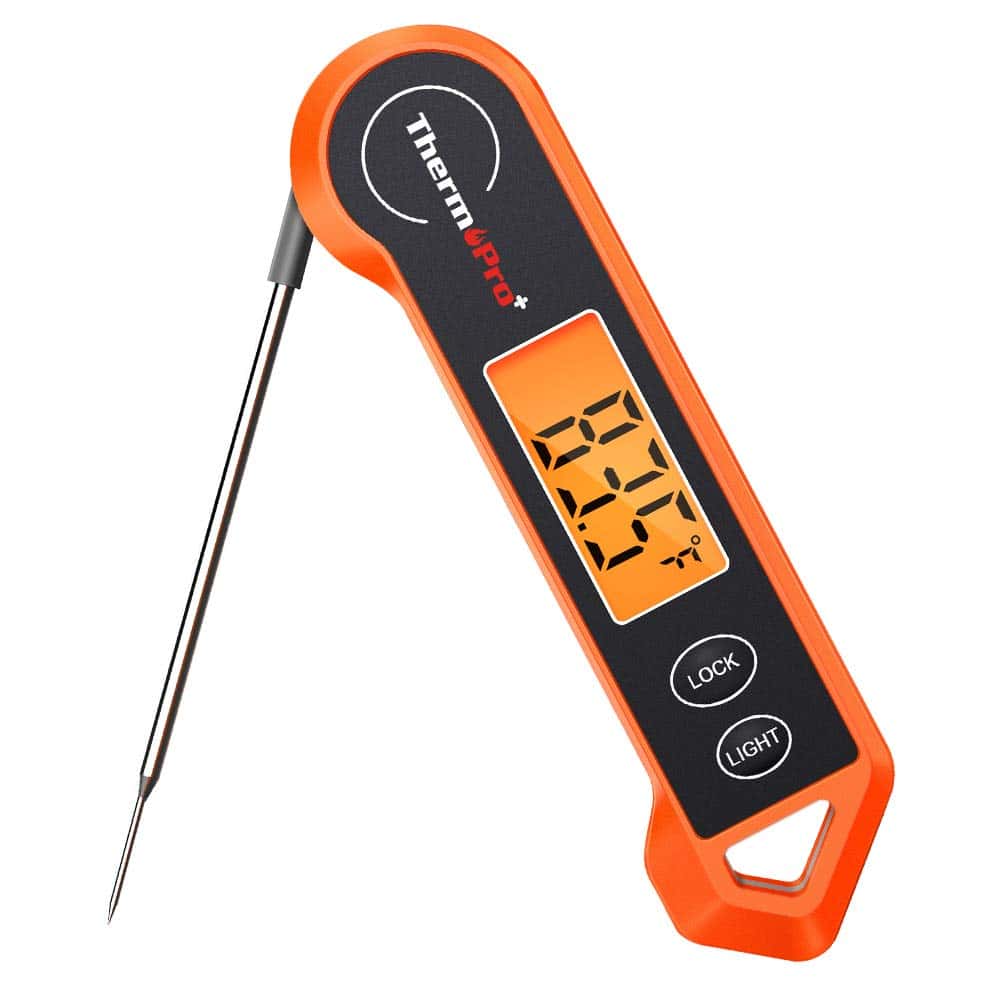 Orange digital food thermometer with folding metal probe, displaying 88.7°F on its screen, and buttons labeled "LOCK" and "LIGHT"—perfect for checking temps when preparing your favorite salad recipes.