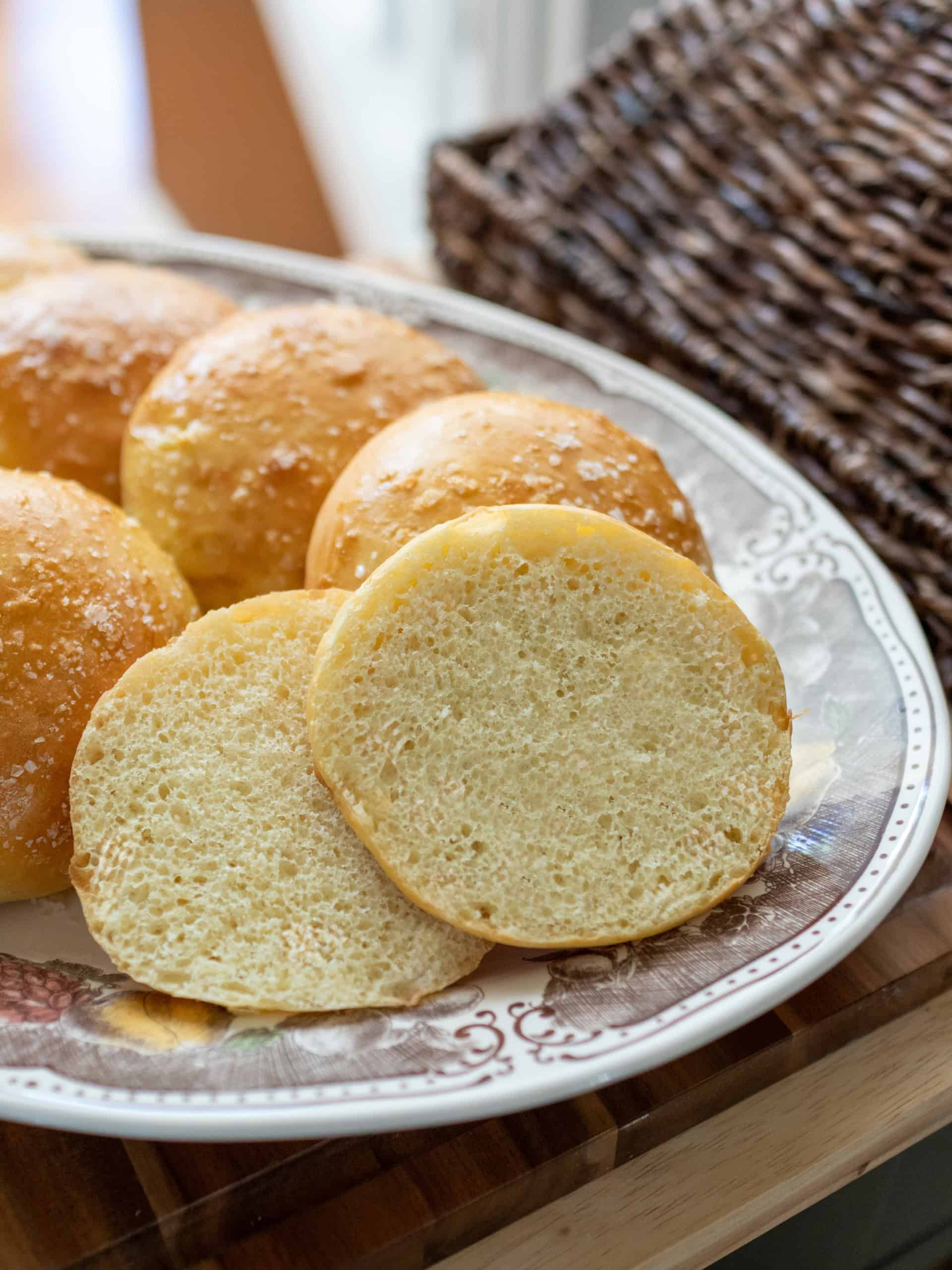 A homemade hamburger bun sliced open to show its soft, fine crumb.