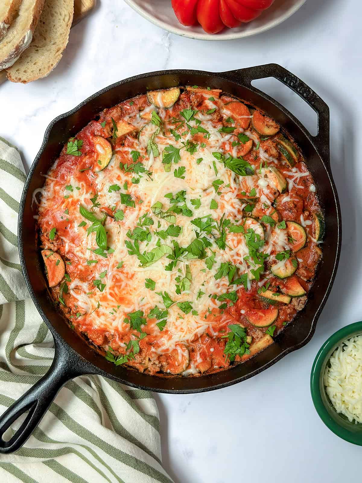 Top view of ground turkey tomato and orzo skillet meal in a cast iron skillet.